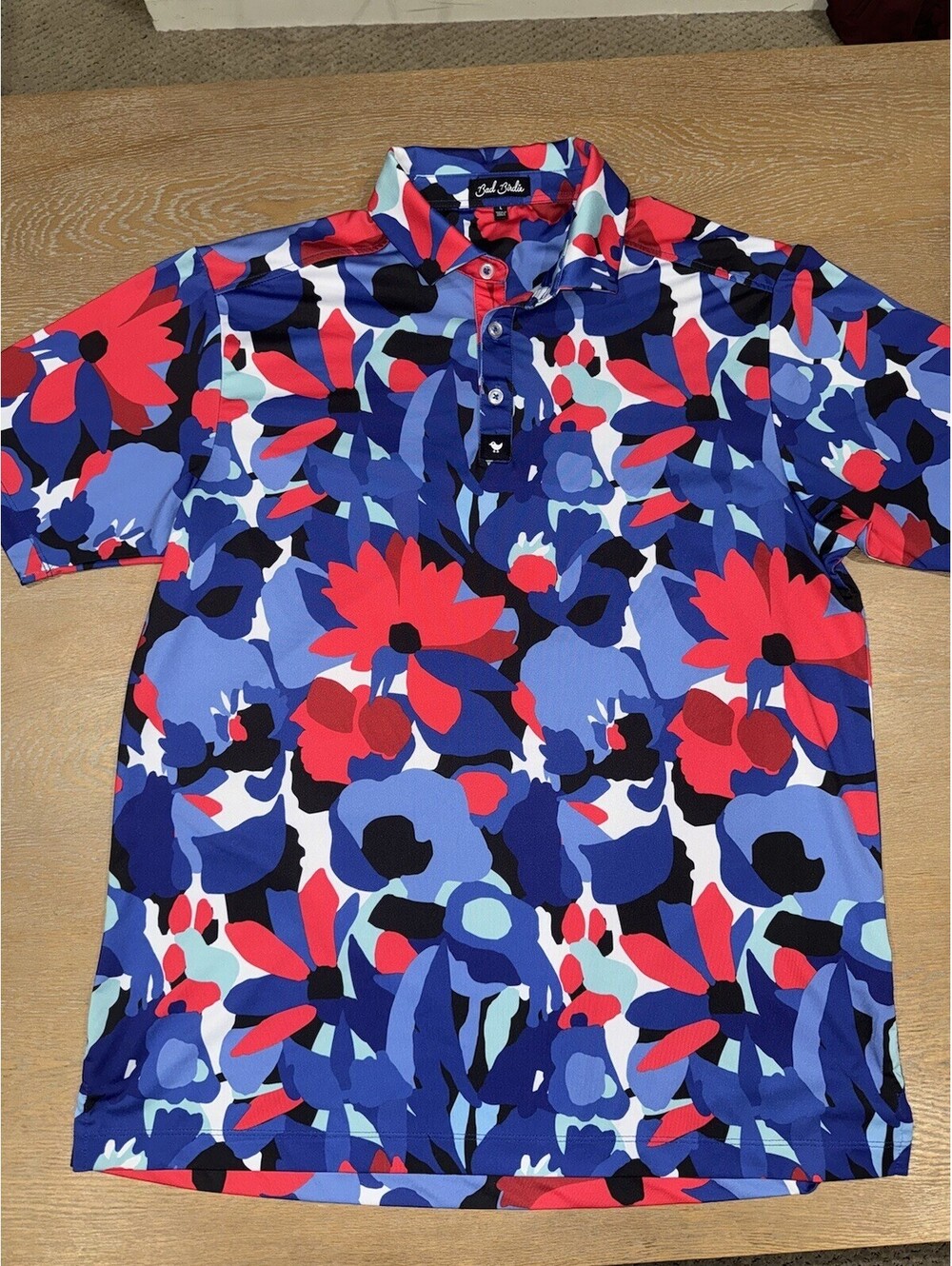 Bad Birdie "Never Lei Up" Men's Core Performance Polo Shirt SIZE LARGE Red Blue